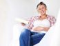 A Pregnant Woman Sitting in Newly Painted Room