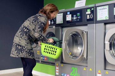 A Woman Washing the Pillow with Machine Machine