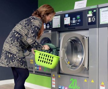 A Woman Washing the Pillow with Machine Machine