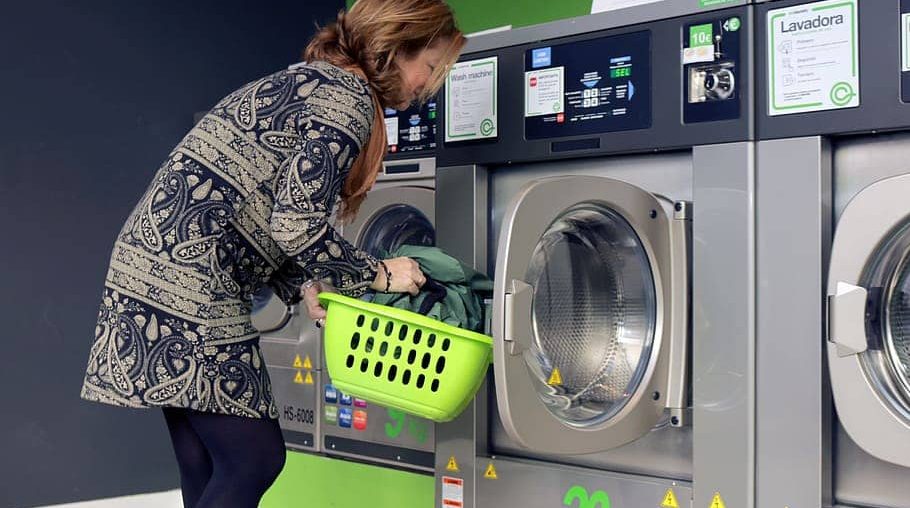 A Woman Washing the Pillow with Machine Machine